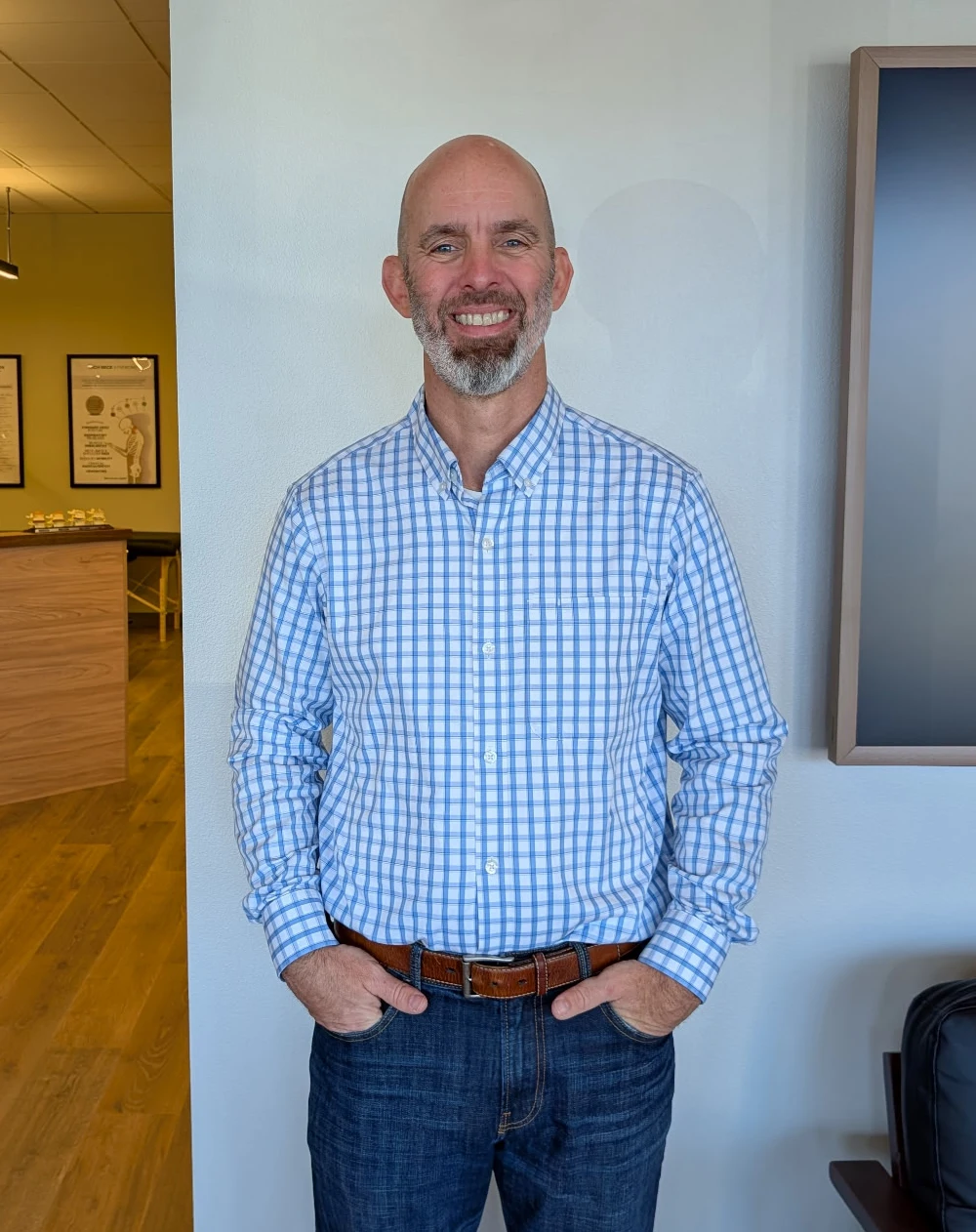 Jeff Devine Posing In Clinic Welcoming Patients